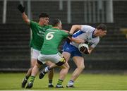 19 June 2016; Patrick Hurney of Waterford in action against Ciarán Gilheaney and Gary Reynolds of Leitrim during the GAA Football All-Ireland Senior Championship Qualifier Round 1A match between Leitrim and Waterford at Páirc Seán Mac Diarmada in Carrick-on-Shannon, Co Leitrim. Photo by Seb Daly/Sportsfile