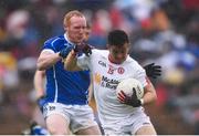 19 June 2016; Ronan O’Neill of Tyrone is tackled by Cian Mackey of Cavan during the Ulster GAA Football Senior Championship Semi-Final match between Tyrone and Cavan at St Tiernach's Park in Clones, Co Monaghan. Photo by Ramsey Cardy/Sportsfile