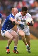 19 June 2016; Ronan O’Neill of Tyrone is tackled by Cian Mackey of Cavan during the Ulster GAA Football Senior Championship Semi-Final match between Tyrone and Cavan at St Tiernach's Park in Clones, Co Monaghan. Photo by Ramsey Cardy/Sportsfile