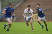 19 June 2016; Richard Donnelly of Tyrone in action against Tomas Corr and Killian Brady of Cavan during the Ulster GAA Football Senior Championship Semi-Final match between Tyrone and Cavan at St Tiernach's Park in Clones, Co Monaghan. Photo by Oliver McVeigh/Sportsfile