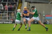 19 June 2016; Padraic Maher of Tipperary in action against Tom Condon, left, and Seamus Hickey of Limerick during the Munster GAA Hurling Senior Championship Semi-Final match between Limerick and Tipperary at Semple Stadium in Thurles, Co Tipperary. Photo by Daire Brennan/Sportsfile