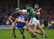 19 June 2016; Diarmaid Byrnes of Limerick in action against Niall O'Meara, 23, Tomas Cahill and Noel McGrath, left, of Tipperary during the Munster GAA Hurling Senior Championship Semi-Final match between Limerick and Tipperary at Semple Stadium in Thurles, Co Tipperary. Photo by Ray McManus/Sportsfile
