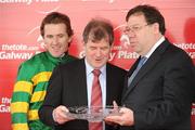 28 July 2010; Jockey Tony McCoy and winning owner J.P. McManus are presented with the Galway Plate by an Taoiseach Brian Cowen, T.D., after Finger Onthe Pulse had won the www.thetote.com Galway Plate, Steeplechase Handicap, Grade A. Galway Racing Festival 2010, Ballybrit, Galway. Picture credit: Ray McManus / SPORTSFILE