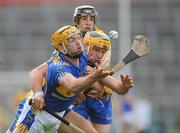 28 July 2010; Padraic Maher, Tipperary, in action against John Conlon and Fergus Kennedy, Clare. Bord Gáis Energy GAA Hurling Under 21 Munster Championship Final, Tipperary v Clare, Semple Stadium, Thurles, Co. Tipperary. Picture credit: Diarmuid Greene / SPORTSFILE