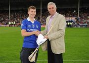 28 July 2010; Stephen Maher, from Thurles Sarsfields GAA Club, is presented with his prize by Ger Cunningham, Sports Sponsorship manager Bord Gáis Energy, following his victory in the Bord Gáis Energy Crossbar Challenge at half-time in the Bord Gais Energy GAA Hurling Under 21 Munster Championship Final between Clare and Tipperary. Semple Stadium, Thurles, Co. Tipperary. Picture credit: Diarmuid Greene / SPORTSFILE
