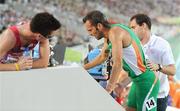 28 July 2010; Ireland's Thomas Chamney is helped from the TV flash area after his semi-final of the Men's 1500m where he finished in 9th place in a time of 3:43.60 and failed to make the final. 20th European Athletics Championships Montjuïc Olympic Stadium, Barcelona, Spain. Picture credit: Brendan Moran / SPORTSFILE