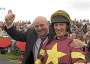 29 July 2010; Jockey Paul Carberry celebrates with winning owner John Earls after winning the Perfect Pint Beginners Steeplechase on Chicago Grey. Galway Racing Festival 2010, Ballybrit, Galway. Picture credit: Ray McManus / SPORTSFILE