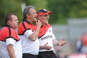 18 July 2010; Tyrone manager Mickey Harte, right, along with assistant manager Tony Donnelly, centre, and trainer Fergal McCann during the game. Ulster GAA Football Senior Championship Final, Monaghan v Tyrone, St Tighearnach's Park, Clones, Co. Monaghan. Picture credit: Oliver McVeigh / SPORTSFILE