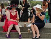 29 July 2010; Two patrons of Ladies Day enjoy a spot of lunch before racing. Galway Racing Festival 2010, Ballybrit, Galway. Picture credit: Ray McManus / SPORTSFILE