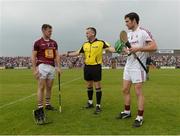 5 June 2016; Referee Diarmuid Kirwan with team captains Aonghus Clarke of Westmeath, left, and David Burke of Galway prior to the Leinster GAA Hurling Senior Championship Quarter-Final between Westmeath and Galway in TEG Cusack Park, Mullingar, Co. Westmeath. Photo by Piaras Ó Mídheach/Sportsfile