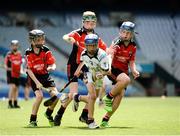 21 June 2016; Andrew Dillon of Scoil San Treasa, Mount Merrion, Dublin, in action against, from left, Oisin Byrne, James O'Brien and Thomas Nolan of St Colmcilles Senior National School, Knocklyon, Dublin during the Corn Herald match between St Colmcilles Senior National School and Scoil San Treasa during the Allianz Cumann na mBunscol Finals at Croke Park in Dublin. Photo by Sam Barnes/SPORTSFILE