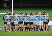 30 July 2010; The Leinster/Ulster squad huddle up to receive instructions during an open training session ahead of their combined provinces match against Munster/Connacht to mark the opening of the new Aviva Stadium on Saturday. Aviva Stadium, Lansdowne Road, Dublin. Picture credit: Barry Cregg / SPORTSFILE