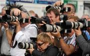 29 July 2010; Press photographers at work during Ladies day at the races. Galway Racing Festival 2010, Ballybrit, Galway. Picture credit: Ray McManus / SPORTSFILE