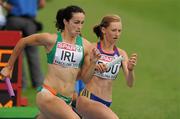 31 July 2010; Ireland's Brona Furlong races alongside Bianca Razor, of Romania, during the 3rd leg of the Women's 4 x 400m where Ireland finished 4th in a time of 3:30.11 but failing to qualify for the final. 20th European Athletics Championships Montjuïc Olympic Stadium, Barcelona, Spain. Picture credit: Brendan Moran / SPORTSFILE