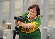 31 July 2010; An early patron on Hill 16, Breda Ferris, from Listowel, Co Kerry, reviews her photographs from the minor game. Supporters at the GAA Football All-Ireland Senior Championship Quarter-Finals, Croke Park, Dublin. Picture credit: Ray McManus / SPORTSFILE