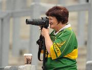 31 July 2010; An early patron on Hill 16, Breda Ferris, from Listowel, Co Kerry, takes a few pictures of the minor game. Supporters at the GAA Football All-Ireland Senior Championship Quarter-Finals, Croke Park, Dublin. Picture credit: Ray McManus / SPORTSFILE