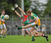 31 July 2010; Declan Hogan, Offaly, in action against Jack McDonnell, Mayo. ESB GAA Football All-Ireland Minor Championship Quarter-Final, Mayo v Offaly, Dr. Hyde Park, Roscommon. Picture credit: Barry Cregg / SPORTSFILE