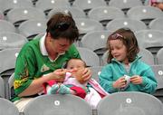 31 July 2010; Áine O'Sullivan, from Waterville, Co. Kerry,  accompained by her four-year-old daughter Sarah, feeds eight and a half month old Aisling, during the minor game. Supporters at the GAA Football All-Ireland Senior Championship Quarter-Finals, Croke Park, Dublin. Picture credit: Ray McManus / SPORTSFILE