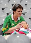 31 July 2010; Áine O'Sullivan, from Waterville, Co. Kerry,  keeps an eye on the match as she feeds eight and a half month old Aisling during the minor game. Supporters at the GAA Football All-Ireland Senior Championship Quarter-Finals, Croke Park, Dublin. Picture credit: Ray McManus / SPORTSFILE