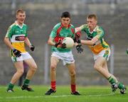 31 July 2010; Seán Kelly, Mayo, in action against Declan Hogan and Conor Lowry, right, Offaly. ESB GAA Football All-Ireland Minor Championship Quarter-Final, Mayo v Offaly, Dr. Hyde Park, Roscommon. Picture credit: Barry Cregg / SPORTSFILE