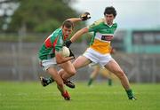 31 July 2010; Michael Forde, Mayo, in action against Paul McPadden, Offaly. ESB GAA Football All-Ireland Minor Championship Quarter-Final, Mayo v Offaly, Dr. Hyde Park, Roscommon. Picture credit: Barry Cregg / SPORTSFILE