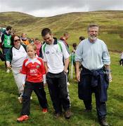 31 July 2010; Sinn Féin President Gerry Adams, right, with Bernard Dunne and 10-year-old James Shevlin, left, during the 2010 M Donnelly Poc Fada na hÉireann. Annaverna Mountains, Dundalk, Co. Louth. Picture credit: Ray Lohan / SPORTSFILE