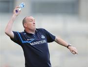 31 July 2010; Dublin manager Pat Gilroy throws a water bottle on to one of his players in the closing minutes. GAA Football All-Ireland Senior Championship Quarter-Final, Tyrone v Dublin, Croke Park, Dublin. Picture credit: Oliver McVeigh / SPORTSFILE