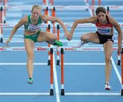 31 July 2010; Ireland's Derval O'Rourke in action alongside Carolin Nytra, of Germany, during her semi-final of the Women's 100m Hurdles where she qualified for the final in a season best time of 12.75 sec. 20th European Athletics Championships Montjuïc Olympic Stadium, Barcelona, Spain. Picture credit: Brendan Moran / SPORTSFILE