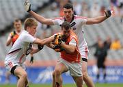 1 August 2010; Dean Nugent, Armagh, in action against Daniel Fitzgerald and Stephen O'Mahony, Cork. ESB GAA Football All-Ireland Minor Championship Quarter-Final, Cork v Armagh, Croke Park, Dublin. Picture credit: Oliver McVeigh / SPORTSFILE