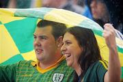 1 August 2010; Two Meath supporters shelter from the rain during the game. Supporters at the GAA Football All-Ireland Senior Championship Quarter-Finals, Croke Park, Dublin. Picture credit: David Maher / SPORTSFILE