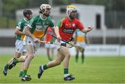 23 June 2016; Farren O'Neill of Carlow in action against Ben Conneely of Offaly during the Bord Gáis Energy Leinster GAA Hurling U21 Championship Semi-Final match between Carlow and Offaly at Netwatch Cullen Park in Carlow. Photo by Matt Browne/Sportsfile