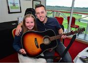23 June 2016; Singer Nathan Carter with Make-A-Wish recipient Katie Cronin, age 11, from Kilmichael, Co Cork, on Kate's birthday during the Bulmer's Evening Meeting at Leopardstown Racecourse in Leopardstown, Dublin. Photo by Cody Glenn/Sportsfile