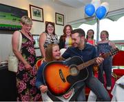 23 June 2016; Singer Nathan Carter with Make-A-Wish recipient Katie Cronin, age 11, from Kilmichael, Co Cork, on Kate's birthday during the Bulmer's Evening Meeting at Leopardstown Racecourse in Leopardstown, Dublin. Photo by Cody Glenn/Sportsfile