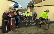 24 June 2016; 100 cyclists set off on their 2 day journey from the Capuchin Day Centre in Smithfield to Belmullet, Co. Mayo. The cyclists, among them Mayo legend David Brady, are closing in on their fundraising target of €100,000 which will go directly to the Capuchin Day Centre which has been providing relief for the homeless since 1969. Pictured is Brother Kevin Crowley, far left, as he applauds cyclsits as they leave on their journey. Capuchin Day Centre, Smithfield, Dublin. Photo by Seb Daly/Sportsfile