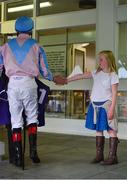 23 June 2016; Jockey Pat Smullen is greeted by a young racegoer during the Bulmer's Evening Meeting at Leopardstown Racecourse in Leopardstown, Dublin. Photo by Cody Glenn/Sportsfile
