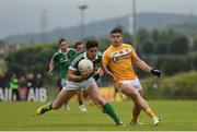25 June 2016; Padraig Browne of Limerick in action against Patrick Mc Bride of Antrim during the All-Ireland Football Senior Championship 1B qualifier game between Antrim and Limerick at Corrigan Park in Belfast. Photo by Ramsey Cardy/Sportsfile