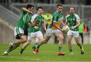 25 June 2016; Niall McNamee of Offaly in action against London's from left, James Moran, Ciarán Dunne and Adrian Moyles during the GAA Football All-Ireland Senior Championship Round 1B game between Offaly and London at O'Connor Park in Tullamore, Co Offaly. Photo by Piaras Ó Mídheach/Sportsfile