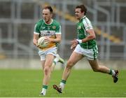 25 June 2016; Graham Guilfoyle of Offaly in action against Cathal Óg Greene of London during the GAA Football All-Ireland Senior Championship Round 1B game between Offaly and London at O'Connor Park in Tullamore, Co Offaly. Photo by Piaras Ó Mídheach/Sportsfile