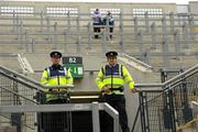 31 July 2010; Two Gardai and two Dublin supporters on Hill 16 long before the games. Supporters at the GAA Football All-Ireland Senior Championship Quarter-Finals, Croke Park, Dublin. Picture credit: Ray McManus / SPORTSFILE