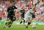4 August 2010; Wayne Rooney, Manchester United, in action against Shaun Williams, Airtricity League XI. Friendly Match, Airtricity League XI v Manchester United, Aviva Stadium, Lansdowne Road, Dublin. Picture credit: David Maher / SPORTSFILE