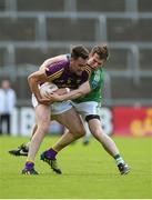 25 June 2016; Daithi Waters of Wexford in action against Tomas Corrigan of Fermanagh during their GAA Football All-Ireland Senior Championship Round 1B match at Innovate Wexford Park in Wexford. Photo by Diarmuid Greene/Sportsfile