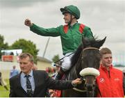 25 June 2016; Pat Smullen celebrates winning the Dubai Duty Free Irish Derby on Harzand at the Curragh Racecourse in the Curragh, Co. Kildare. Photo by Cody Glenn/Sportsfile