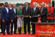 25 June 2016; Jockey Pat Smullen and the winning connections of Harzand including trainer Dermot Weld, sixth from left, after winning the Dubai Duty Free Irish Derby on Harzand at the Curragh Racecourse in the Curragh, Co. Kildare. Photo by Cody Glenn/Sportsfile