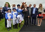25 June 2016; Jockey Colin Keane and winning connections of Medicine Jack including owner Sean Jones, second from right, and trainer Ger Lyons, third from right, in the winner's enclosure after winning the Gain Railway Stakes at the Curragh Racecourse in the Curragh, Co. Kildare. Photo by Cody Glenn/Sportsfile