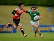 25 June 2016; Lucy Mulhall of Ireland is tackled by Shen Leilei of China during the World Rugby Women's Sevens Olympic Repechage Pool C match between Ireland and China at UCD Sports Centre in Belfield, Dublin. Photo by Seb Daly/Sportsfile