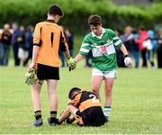 25 June 2016; Ryan O'Grady of Legoin shakes hands with Ben Quilter and Luke Chester of Austin Stacks during the John West Féile Peile na nÓg at Dr Crokes in Killarney. Photo by Michelle Cooper Galvin/Sportsfile