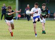 25 June 2016; Robert Corridan of New York in action against Robert Dillon of Nemo Rangers during the John West Féile Peile na nÓg at Dr Crokes in Killarney. Photo by Michelle Cooper Galvin/Sportsfile