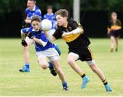 25 June 2016; Tom Doyle of Dr Crokes in action against Patrick Brennan of Laune Rangers during the John West Féile Peile na nÓg at Dr Crokes in Killarney. Photo by Michelle Cooper Galvin/Sportsfile