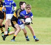 25 June 2016; Callum Russell of Laune Rangers in action against Cillian Hickey of Dr Crokes during the John West Féile Peile na nÓg at Dr Crokes in Killarney. Photo by Michelle Cooper Galvin/Sportsfile