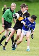 25 June 2016; Jason Kerins of Dr Crokes in action against Gearoid Hassett of Laune Rangers during the John West Féile Peile na nÓg at Dr Crokes in Killarney. Photo by Michelle Cooper Galvin/Sportsfile